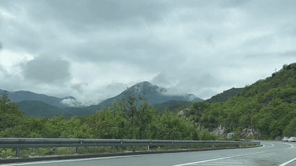 Vehicle travels mountain road in Gornja Brova, Montenegro