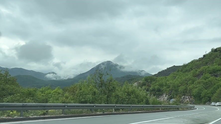Vehicle travels mountain road in Gornja Brova, Montenegro