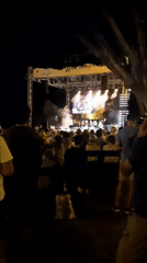 Outdoor concert in Alanya with castle tower as backdrop