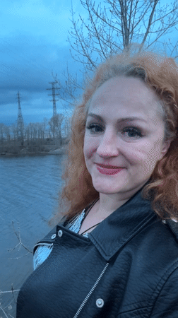 Woman takes selfies by water in Chaikovsky, Russia