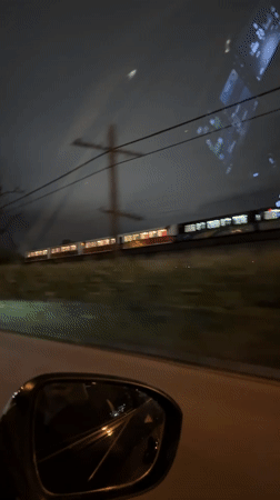 Vehicle records nighttime train travel near New Westminster