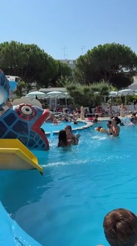 Crowded summer pool day at Hotel Augustus in Gatteo, Italy