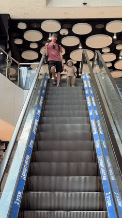 Father and child enjoy morning outing in Sochi shopping district