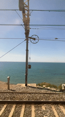 Coastal train journey with violin passenger documented near Sitges