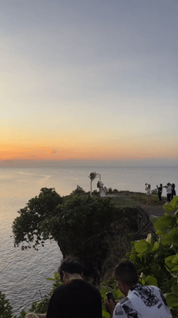 Clifftop wedding ceremony held at sunset in Kuta Selatan