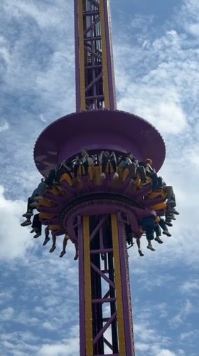 Busy day at Minsk amusement park with rides and performances