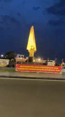 Vehicle captures illuminated monument footage in Phan Thiet Ward