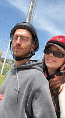 Couple shares electric scooter ride on Tel Aviv park path