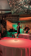 Live band performs at Monaco restaurant under umbrella