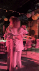 Evening dance gathering with couples in Dobrota, Montenegro