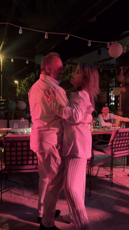 Evening dance gathering with couples in Dobrota, Montenegro