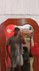 Young man takes mirror selfies at Porlamar home