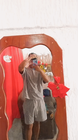 Young man takes mirror selfies at Porlamar home