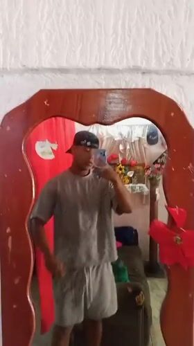 Young man takes mirror selfies at Porlamar home