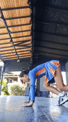 Woman performs yoga routine on stage in Porlamar