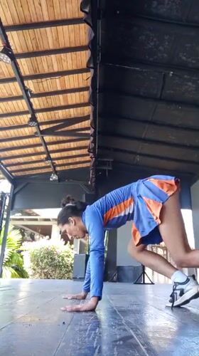 Woman performs yoga routine on stage in Porlamar