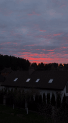 Dramatic sunset paints Belarus village sky in vibrant colors