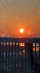 Orange sunset captured by witnesses in Varna, Bulgaria waterfront
