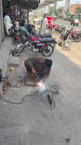 Friday morning street life unfolds across Lahore neighborhoods