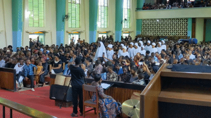 Church ceremony with robed attendees documented in Moshi, Tanzania