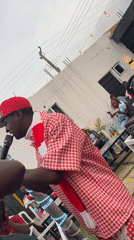 Arsenal fans celebrate outdoors in Gura Top, Nigeria