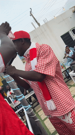 Arsenal fans celebrate outdoors in Gura Top, Nigeria