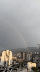 Rainbow appears over Tbilisi during afternoon rain shower