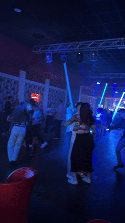 Nightclub scene with dancing couples in Buccinasco, Italy