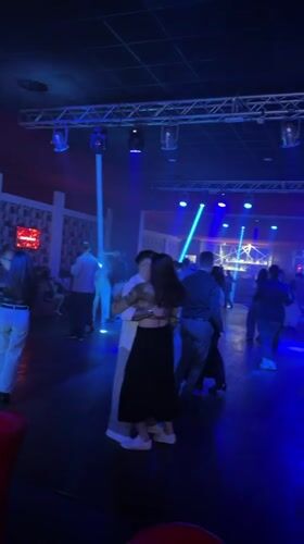 Nightclub scene with dancing couples in Buccinasco, Italy