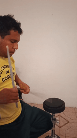 Drummer practices with chocolate cake present in Tinaquillo home