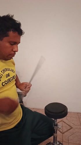Drummer practices with chocolate cake present in Tinaquillo home