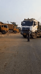 Morning traffic and a parked truck on Banjarmasin roads