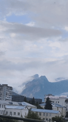 Fog and clouds settle over Karachayevsk's mountains and rooftops