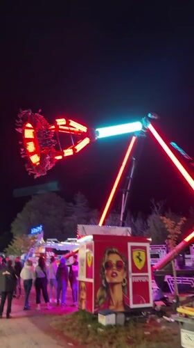 Colorful carnival ride operates at night in Ruse, Bulgaria