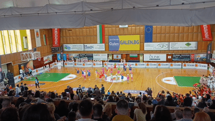 Children perform dance routine at gymnasium competition