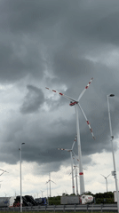 Wind turbines observed under cloudy skies in Parndorf, Austria
