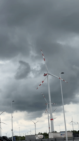 Wind turbines observed under cloudy skies in Parndorf, Austria