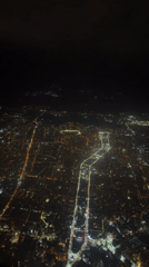 Tbilisi glows at night in aerial city view