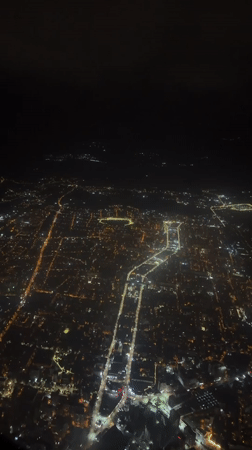 Tbilisi glows at night in aerial city view