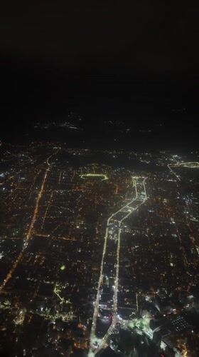 Tbilisi glows at night in aerial city view