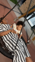 Mother and Baby Enjoy Tire Swing at Kazan Playground