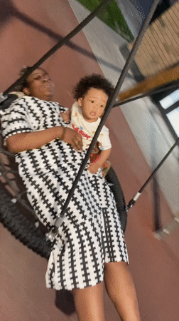 Mother and Baby Enjoy Tire Swing at Kazan Playground