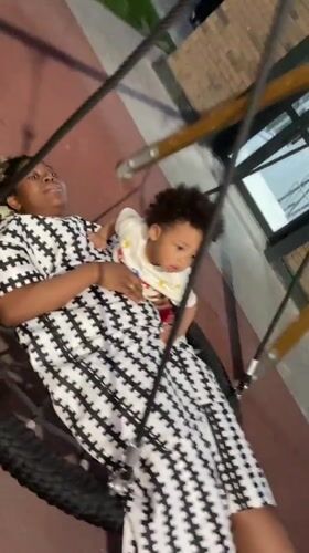 Mother and Baby Enjoy Tire Swing at Kazan Playground