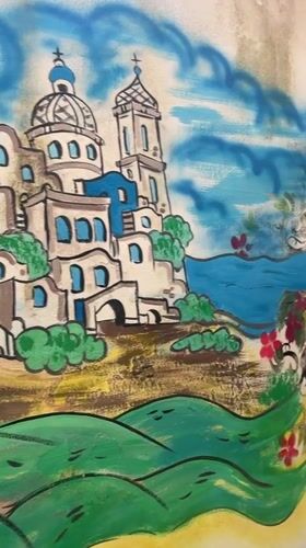 Street scenes, murals, and coastal views in central Salerno