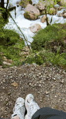 Person rests on rocky ground in Montenegro