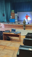 Theater crew sets up stage equipment during early morning rehearsal