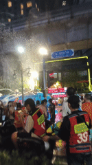 Bangkok street crowds celebrate Songkran with water truck festivities