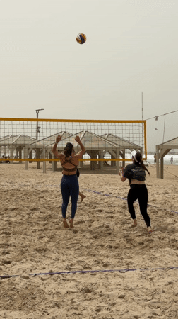 Morning beach recreation in Tel Aviv draws volleyball players