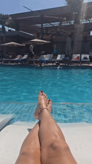 Woman relaxes poolside in leopard bikini in Northern Cyprus