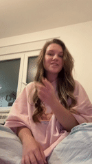 Woman records video message from bedroom in Belgrade suburb